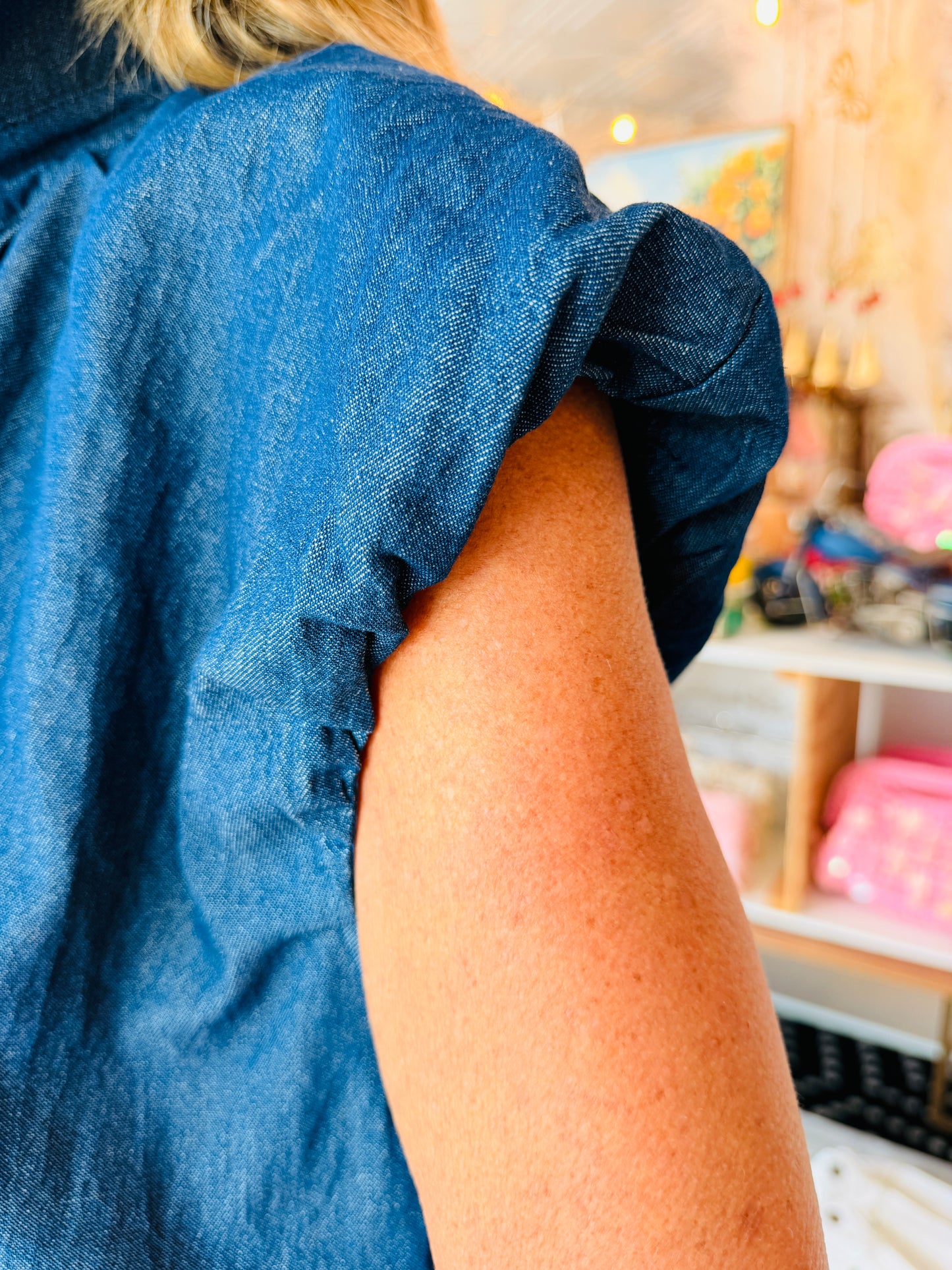 SLEEVELESS DENIM BUBBLE HEM TOP
